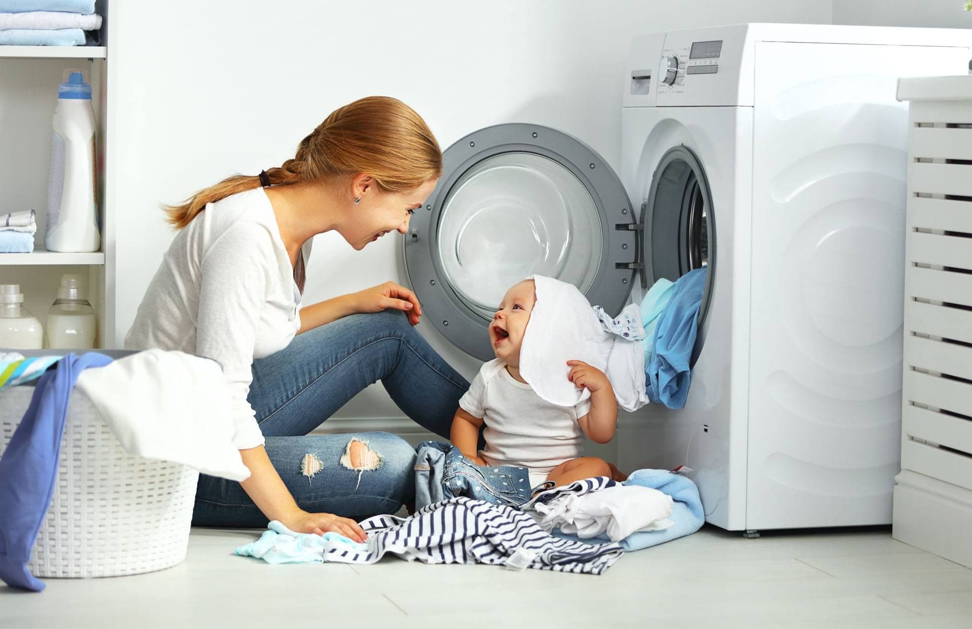 parent and child doing laundry